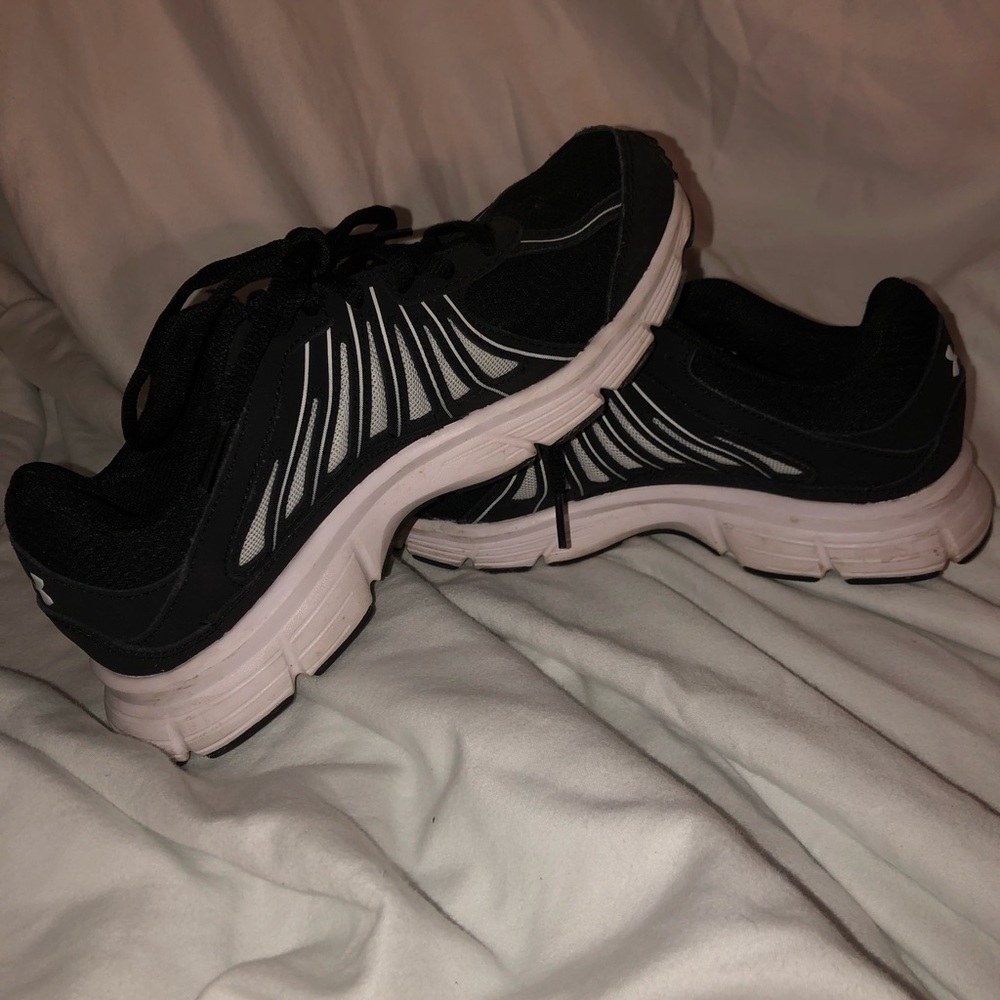 Black abd white Under Armour gum shoes